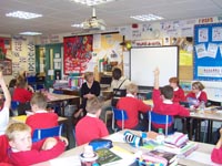 Zakari answers questions from Yr. 6 at Burley and Woodhead Primary School (translations by Dorothy Hardstaffe)
