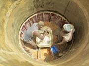 Men working in the well Men working in the well