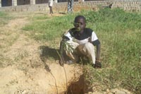 Planting a tree near the school - this boy will look after the tree for the next 12 months Planting a tree near the school - - this boy will look after the tree for the next 12 months
