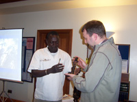 Rev. Tim looking at the statue presented by Zakari at Burley Methodist Church