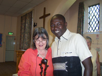 Burley United Reformed Church - Rev. Mirella admires gift presented by Zakari